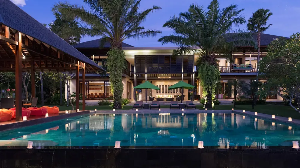 Villa living pavilion opening onto the pool deck, Bali