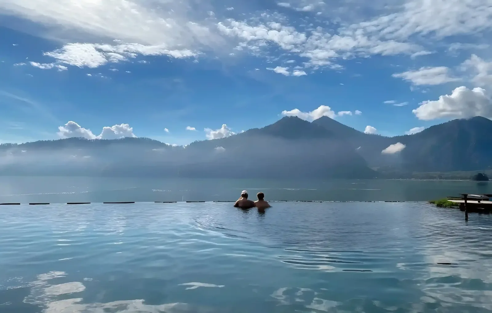 Infinity pool above the Ubud highlands looking across the water to Mount Batur